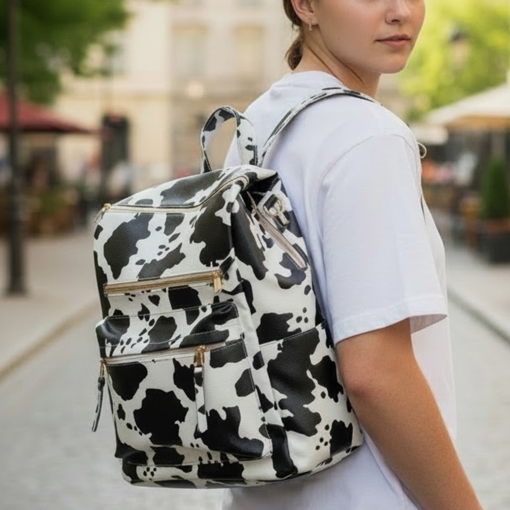 Cute Cow Print Backpack Pleather material. Great condition!